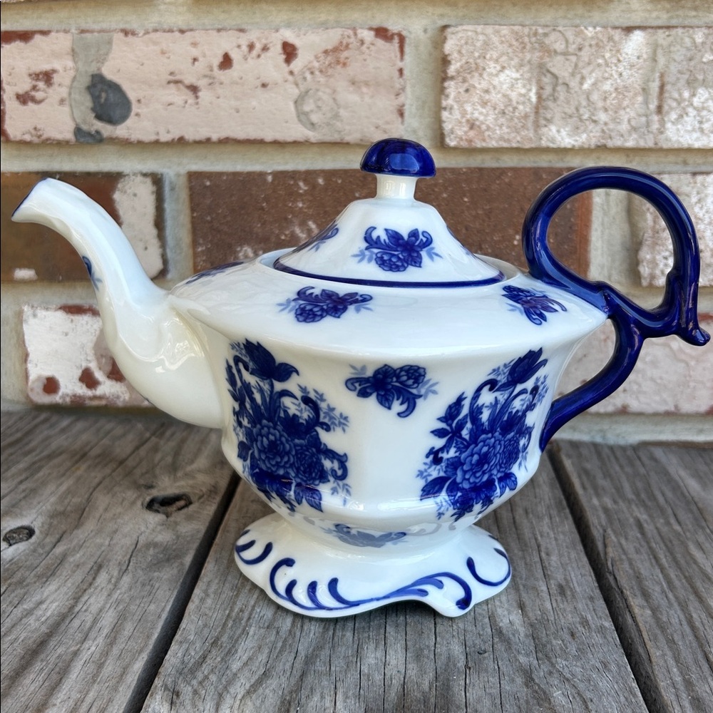 Vintage Blue and White porcelain teapot with a scalloped rim and floral pattern